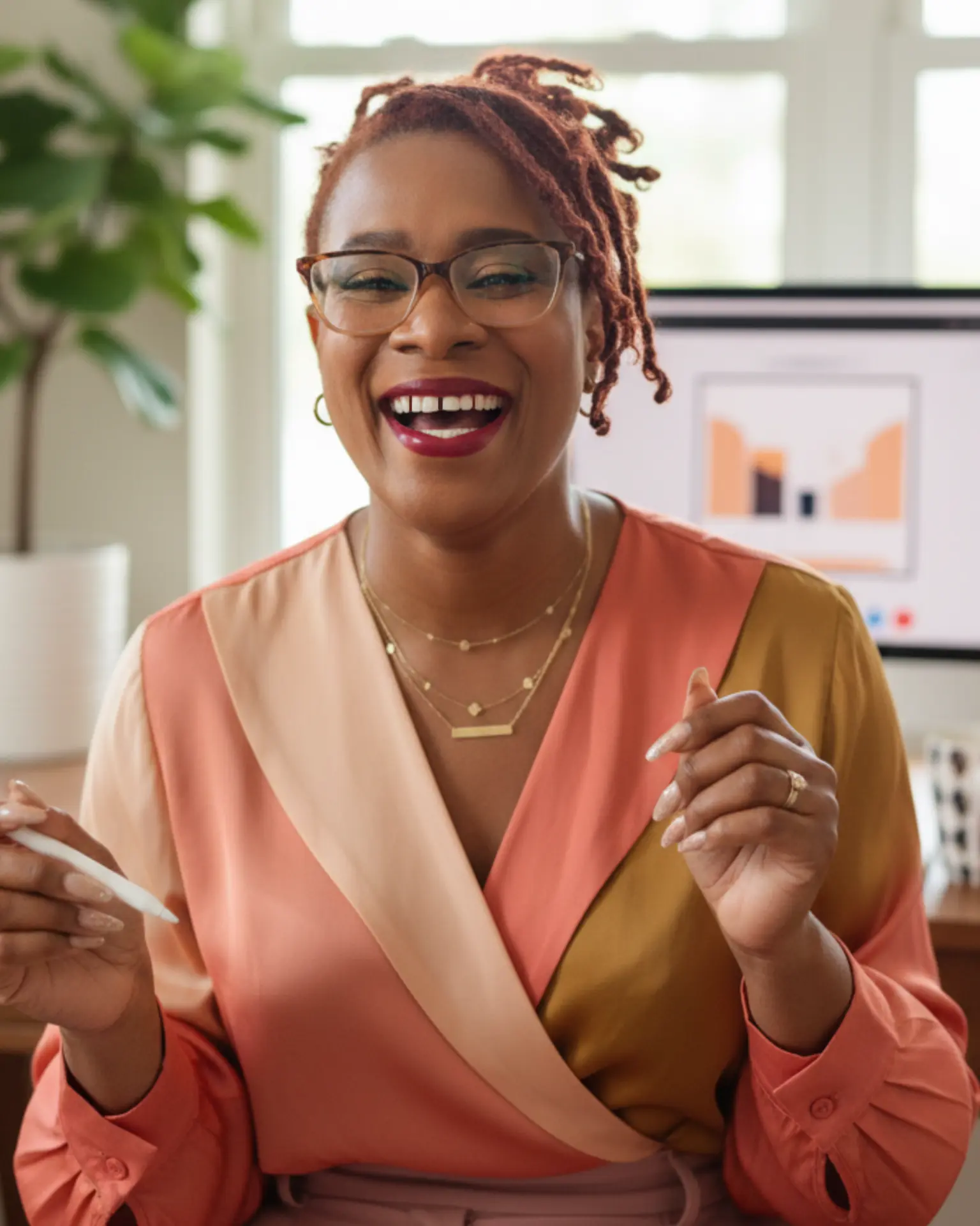 Kreda McCullough laughing during a business conversation